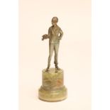 AN ART DECO COLD PAINTED SPELTER SMALL FIGURE of a fashionable young lady with shingled hair,