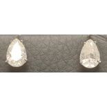 A PAIR OF SOLITAIRE DIAMOND EAR STUDS, the pear cut stones each of approximately 1ct, claw set to