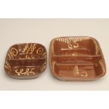 TWO SLIPWARE BAKING DISHES, each of of plain rounded oblong form with central divider and cream slip