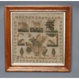 A SAMPLER, c.1800, worked in coloured silks in full cross stitch with a dog flanked by a house and