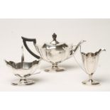 AN EDWARDIAN SILVER THREE PIECE TEA SERVICE, maker Turner Bradbury, London 1903, of lobed oval