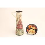 A MOORCROFT POTTERY EWER, modern, of tapering cylindrical form with angular handle, tubelined and