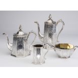 A VICTORIAN SILVER FOUR PIECE TEA SERVICE, maker Robert Hennell, London 1855, of tapering