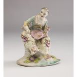 A DERBY FIGURE, c.1755, modelled as a young lady wearing a pale turquoise bodice and flower sprigged