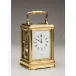 A FRENCH BRASS CASED STRIKING AND REPEATING CARRIAGE CLOCK, the twin barrel movement with platform