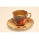 A ROYAL WORCESTER CHINA SMALL CABINET CUP AND SAUCER, c.1950, painted in polychrome enamels by