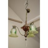 AN ARTS AND CRAFTS COPPER AND BRASS LIGHT PENDANT, the baluster turned stem with central disc and