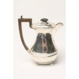 A SILVER COFFEE POT, maker's mark rubbed, Birmingham 1924, of oblong baluster form with everted