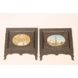 A PAIR OF INDIAN IVORY OVAL PANELS, late 19th century, painted in colours with a view of the "