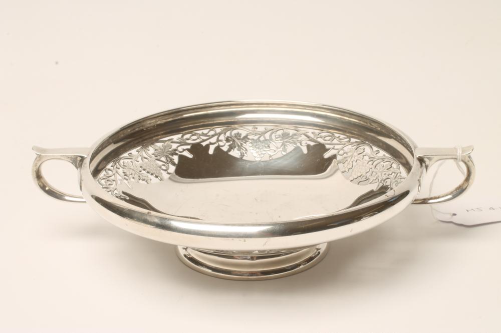 A SILVER SWEETMEAT DISH, makers Thomas Bradbury & Sons, Sheffield 1932, of shallow circular form