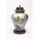 A CHINESE PORCELAIN JAR, of inverted baluster form, painted in underglaze blue and overpainted in