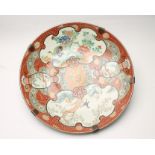 A LARGE JAPANESE IMARI PORCELAIN CHARGER, c.1900, of plain dished circular form, painted in bright