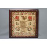 A VICTORIAN WOOLWORK PICTURE, 1857, worked by Sarah Jackson in full cross stitch in coloured wools