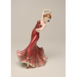 AN ART DECO KATZHUTTE EARTHENWARE FIGURE of a young lady dancer wearing a shaded dusky pink