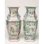 A PAIR OF CHINESE PORCELAIN VASES of inverted baluster hexagonal form with chi-long handles