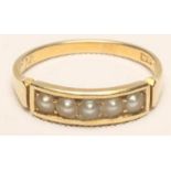 A VICTORIAN 18CT GOLD RING, channel set with five split pearls, dated December 3rd (18)78, size L