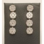 A PAIR OF DIAMOND CLUSTER DROP EAR STUDS, the four clusters each set with nine round brilliant cut