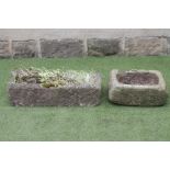 A SANDSTONE TROUGH of narrow oblong form, well cut, 30" x 12 1/2" x 7 1/2", together with another