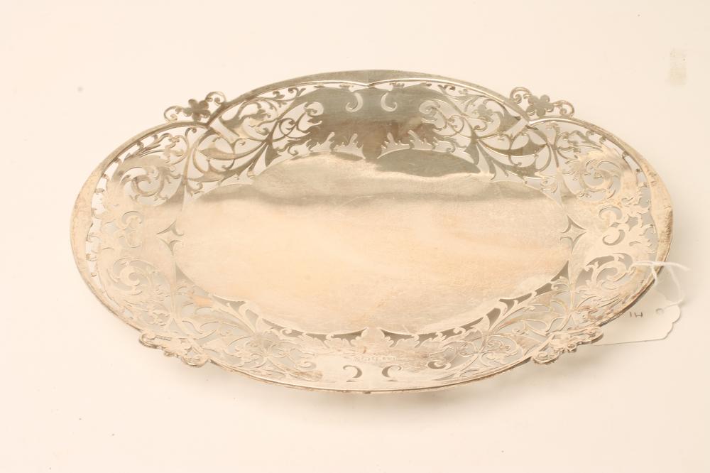 A SILVER DISH, makers Viners, Sheffield 1956, of lobed oval form, the wide rim pierced with