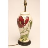 A MOORCROFT POTTERY LAMP BASE, modern, of inverted baluster form, tubelined and painted in shades of