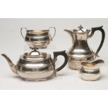 A SILVER FOUR PIECE TEA AND COFFEE SERVICE, makers probably Searle, Hoare & Co., Sheffield 1932,