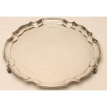 A SILVER SALVER, makers Harrison Fisher & Co., Sheffield 1948, of shaped circular form with piecrust