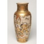 A SATSUMA EARTHENWARE VASE, Meji period, of flared rounded cylindrical form, painted in typical