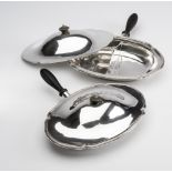 A PAIR OF SILVER VEGETABLE TUREENS, makers A.J. & F.W. Pairpoint, London 1924, of lobed oval form