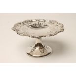 AN EDWARDIAN SILVER PEDESTAL TAZZA, maker's mark WA, Birmingham 1910, the slightly dished shaped