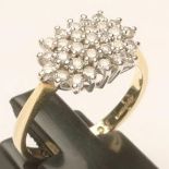 A DIAMOND CLUSTER RING, the shaped oblong panel set to a plain 18ct gold shank, size N 1/2 (Est.