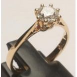 A SOLITAIRE DIAMOND RING, the brilliant cut stone of 0.73cts, claw set to a 9ct gold plain shank,