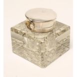 AN EDWARDIAN HEAVY GLASS SILVER MOUNTED INKWELL, maker Joseph Gloster, Birmingham 1903, of square