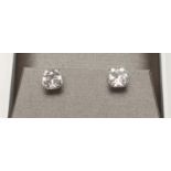 A PAIR OF "CARAT LONDON" BOUTIQUE EAR STUDS, the "Asscher" type cut crystals each equal to