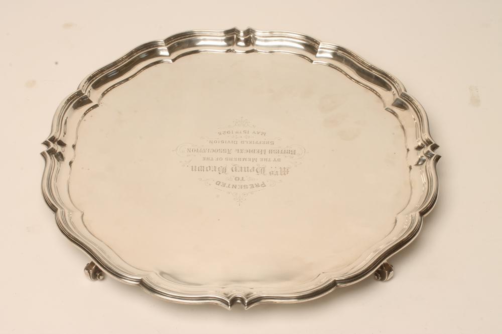 A SILVER SALVER, maker's mark GH, Sheffield 1924, of shaped circular form with piecrust border
