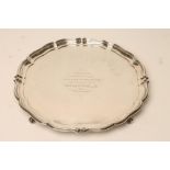 A SILVER SALVER, maker's mark GH, Sheffield 1924, of shaped circular form with piecrust border