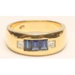 A SAPPHIRE AND DIAMOND BAND RING, the three channel set baguette cut sapphires flanked by a square