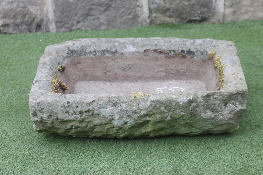 A SANDSTONE TROUGH of oblong form with mildly inward sloping sides, 30" x 18" x 9" (Est. plus 18%