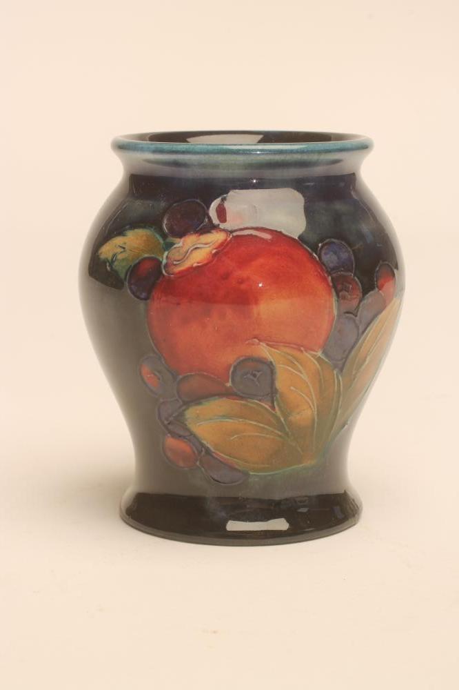 A MOORCROFT POTTERY SMALL VASE, mid 20th century, of inverted baluster form, tubelined and painted