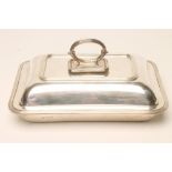 A SILVER ENTREE DISH AND COVER, makers Hutton & Sons Ltd., Sheffield 1936, of plain rounded oblong