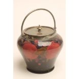 A MOORCROFT POTTERY BISCUIT BARREL, early 20th century, of inverted baluster form, tubelined and