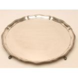 A SILVER SALVER, makers Barker Ellis Silver Co., Birmingham 1967, of shaped circular form, the