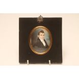 ENGLISH SCHOOL (Early 19th Century), A Gentleman in a Black Frock Coat and White Bow Tie,