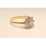 A DIAMOND CLUSTER RING, the nine stones claw set to a plain 18ct gold shank, size M (Est. plus 18%