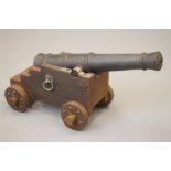 A REPLICA CANNON, 20th century, the 33 1/2" barrel with muzzle swell and trunnions joining it to a