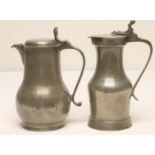 A FRENCH PEWTER WINE JUG, 18th century, of pear form with scrolled loop handle, the flat topped