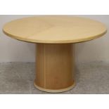 A SKOVBY OF DENMARK EXTENDING MAPLE DINING TABLE, the moulded edged circular top in three sections