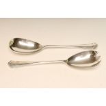 A PAIR OF SILVER SALAD SERVERS, makers Barraclough & Barraclough, Sheffield 1915, with fancy trefoil