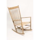 HANS WEGNER FOR FDB MOBLER A J16 ROCKING CHAIR with cord seat, plain comb back with dished top rail,