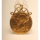 A VICTORIA DIAMOND JUBILEE DOUBLE SIDED GOLD MEDALLION, 1897, in a loose scroll pendant mount, 16.7g