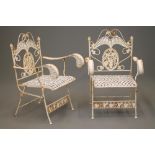 A PAIR OF FOLDING CAST IRON GARDEN ARMCHAIRS, possibly French c.1900, the arched open back with